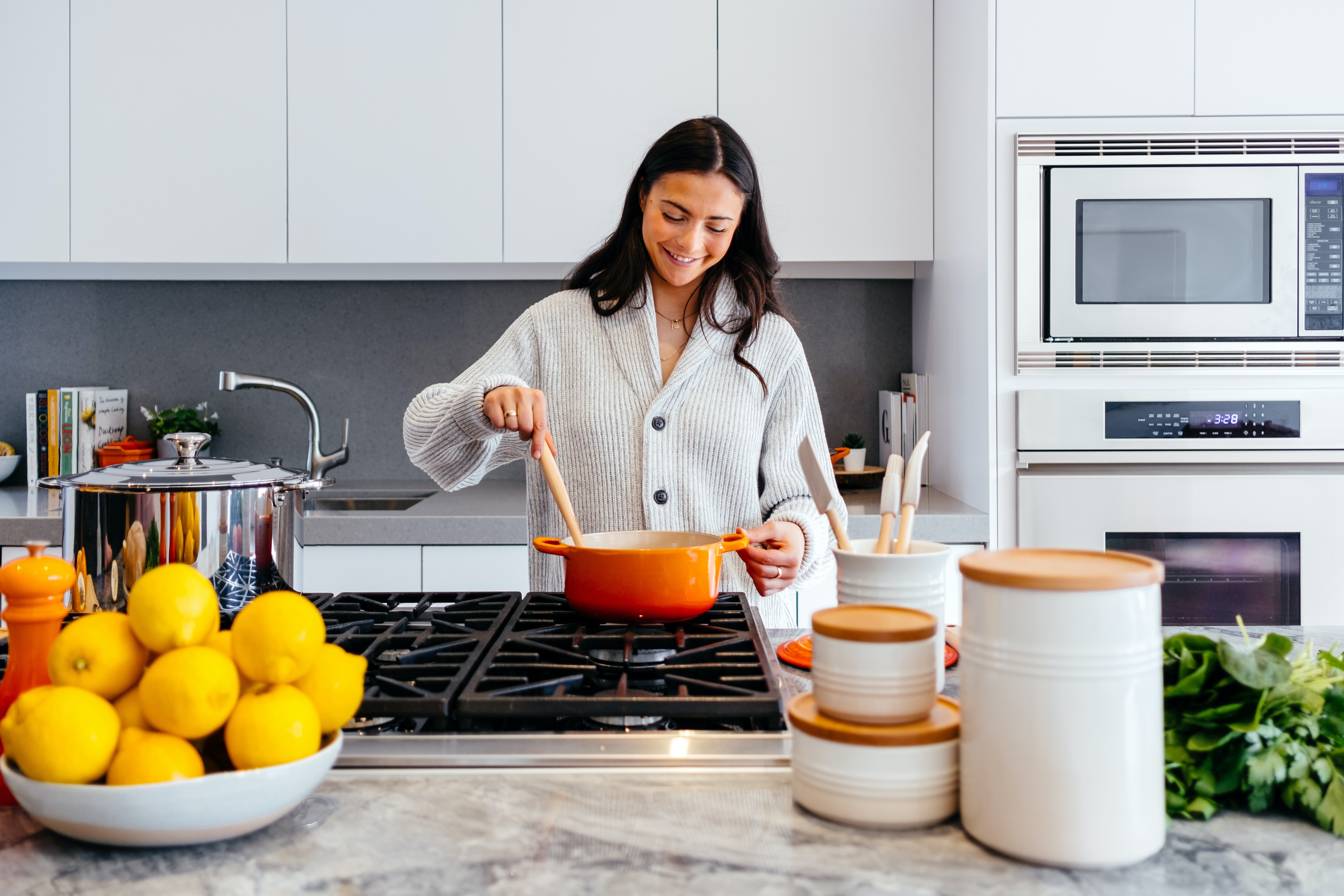 Resident cooking in a bright modern kitchen